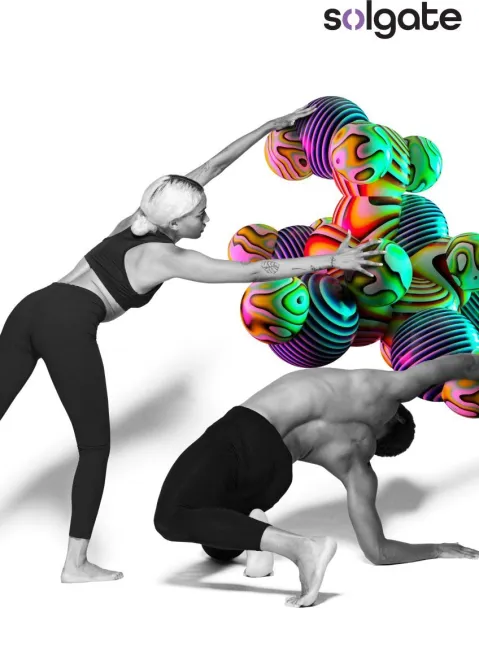 wo dancers in black and white with colorful, abstract, bubble shapes