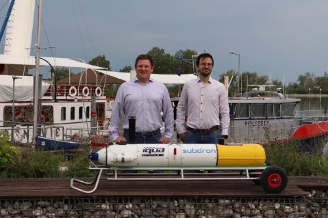 the two founders in behind a subdron drone