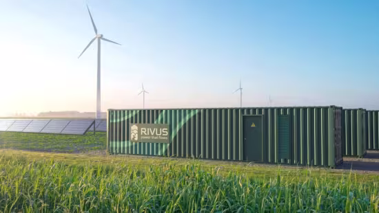 picture of container behind field with wind turbines in the background